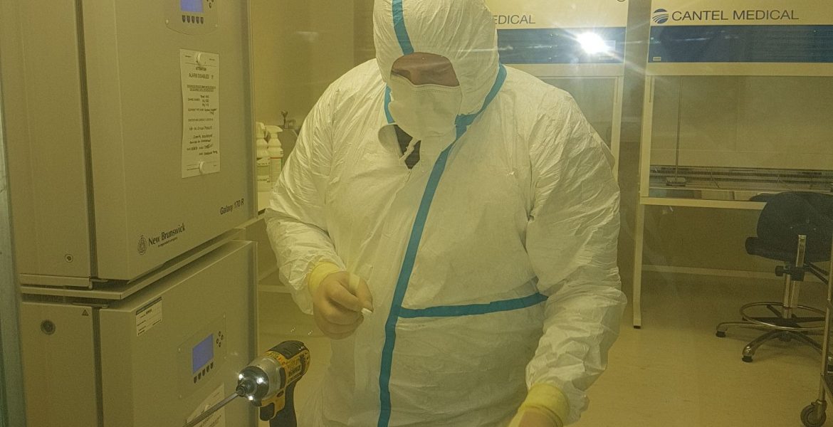 Engineer conducting vital maintenance work in sterile environment